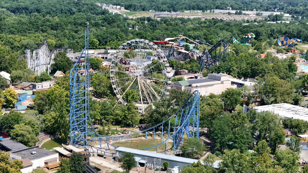 Aerial view of Six Flags St. Louis theme park showing roller coasters and rides surrounded by trees near Eureka, MO