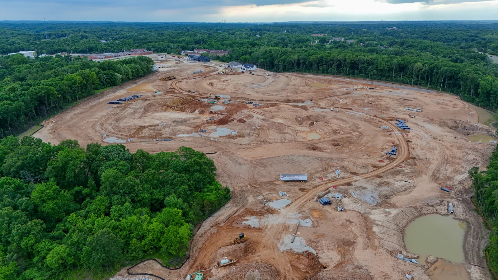 Large aerial view of The Reserve at Wildwood new construction community surrounded by trees in Wildwood, Missouri