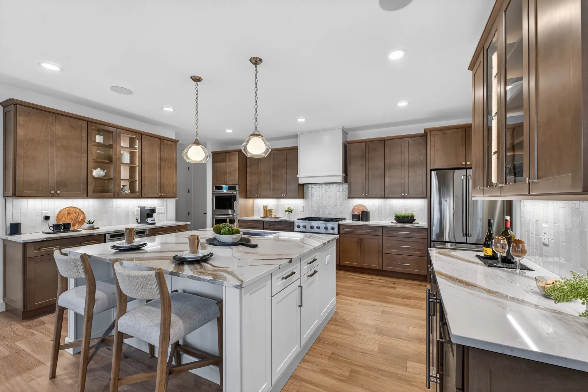 McKelvey Homes kitchen with island and hardwood flooring