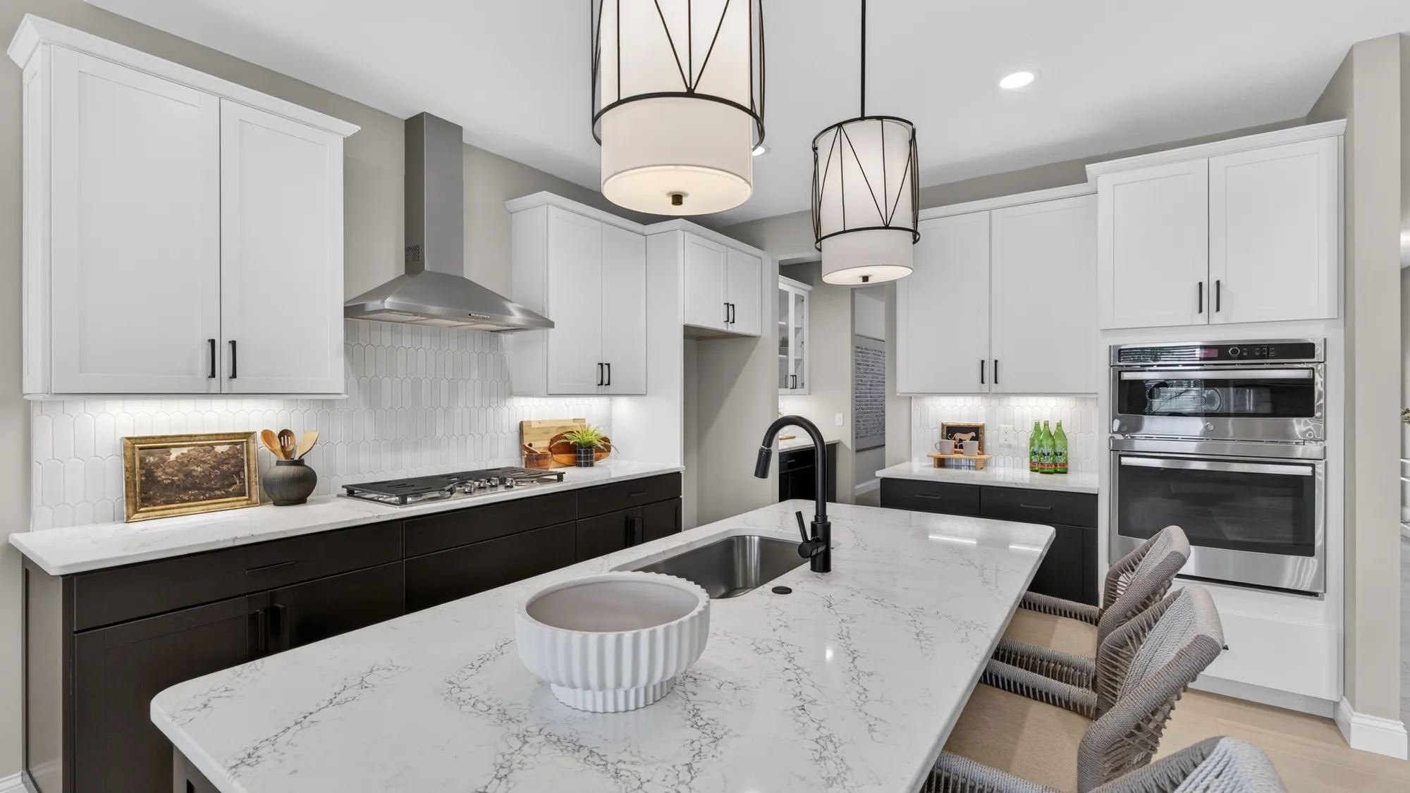 McKelvey Homes kitchen with white cabinets and quartz counters